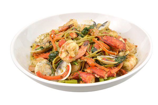 Seafood pescatore with tri-colored pasta, shrimp, lobster, clams, scallops and pesto olive oil sauce. Ti Amo Ristorante Italiano, Tulsa.