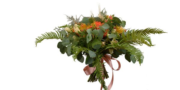 Romantic bouquet with orange garden roses, peach spray roses, broze mums and berries with mixed greens; Wild Iris, Tulsa.