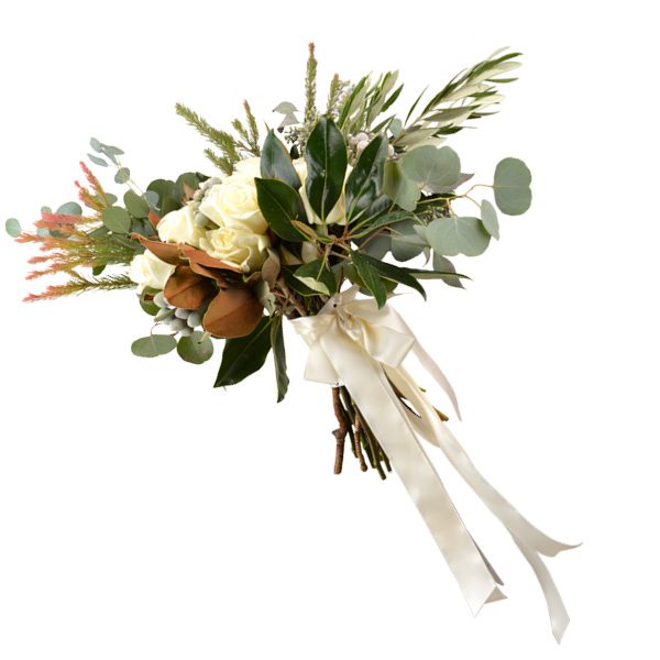 Winter white bouquet with magnolias, white garden roses, Brazilian bell, seeded eucalyptus and protea greens Ted and Debbie’s Flower and Garden, Tulsa. 