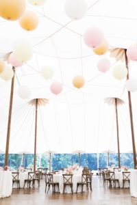 Ambience was important to the couple, who chose to hold the reception in a tent with a ceiling decorated in oversized pastel balloons. A pink ombre style tied the wedding together in every aspect – from the floral arrangements to the bridesmaids’ gowns.