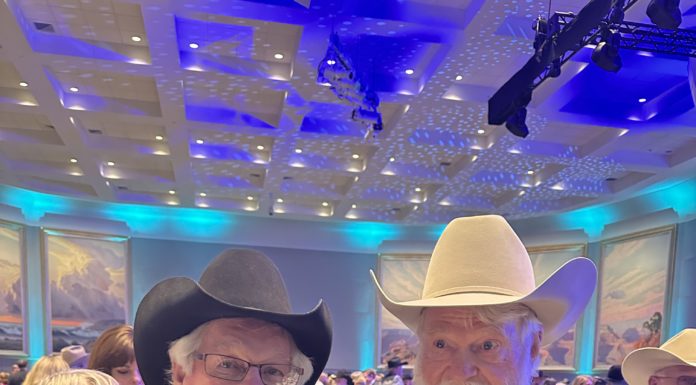 A Man of His Word Ray Bingham (left) poses with longtime friend and client, cowboy music star Red Steagall. Photo courtesy Brett Bingham